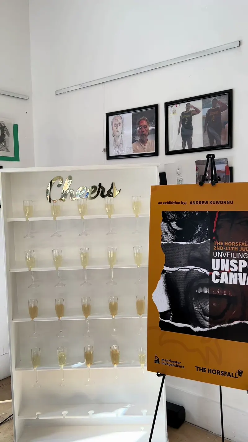 A champagne wall filled with poured flutes beside an exhibition poster for Unveiling the Unspoken Canvas at a Manchester gallery.